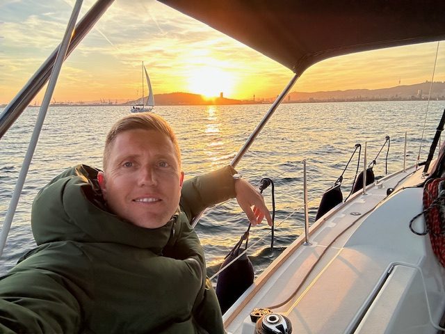 sunset barcelona from a boat